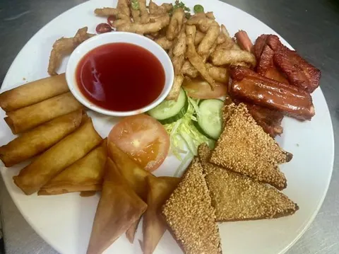 Mixed starter platter with spring rolls, sesame toast and ribs